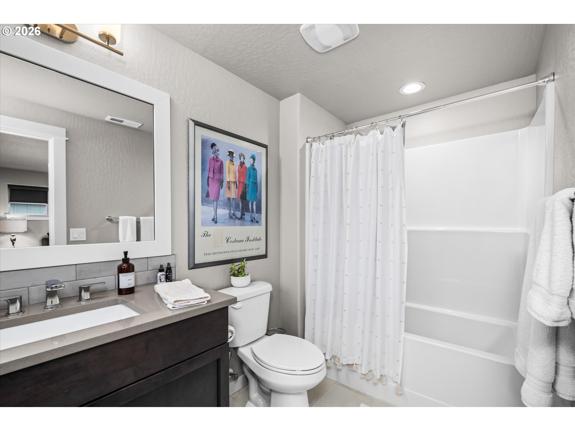 709 Tyson Lane Eugene, OR 97404 - Photo 20 of 31 a bathroom with a sink a toilet a shower and a mirror