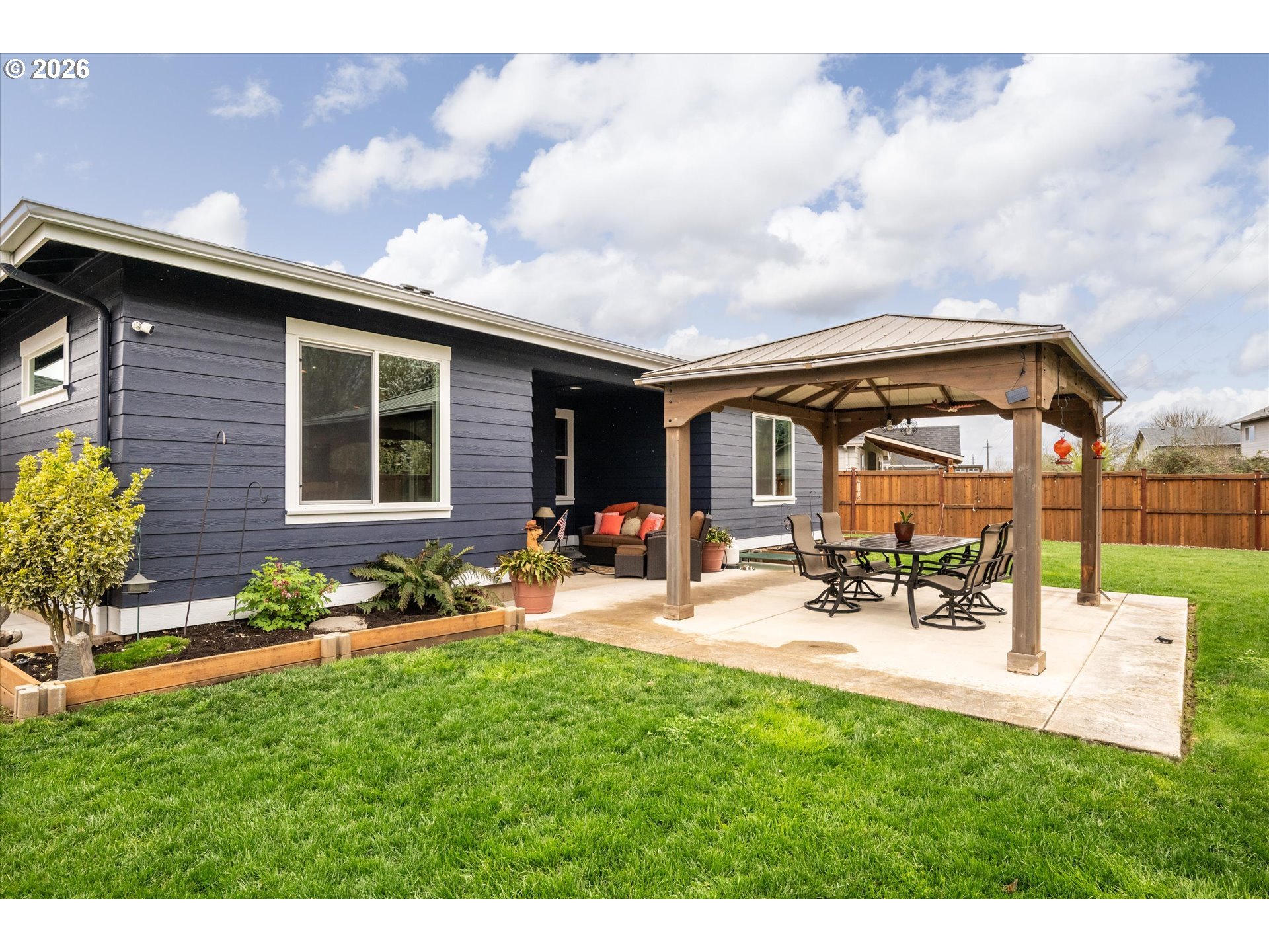 709 Tyson Lane Eugene, OR 97404 - Photo 24 of 31 a view of a backyard with sitting area and furniture