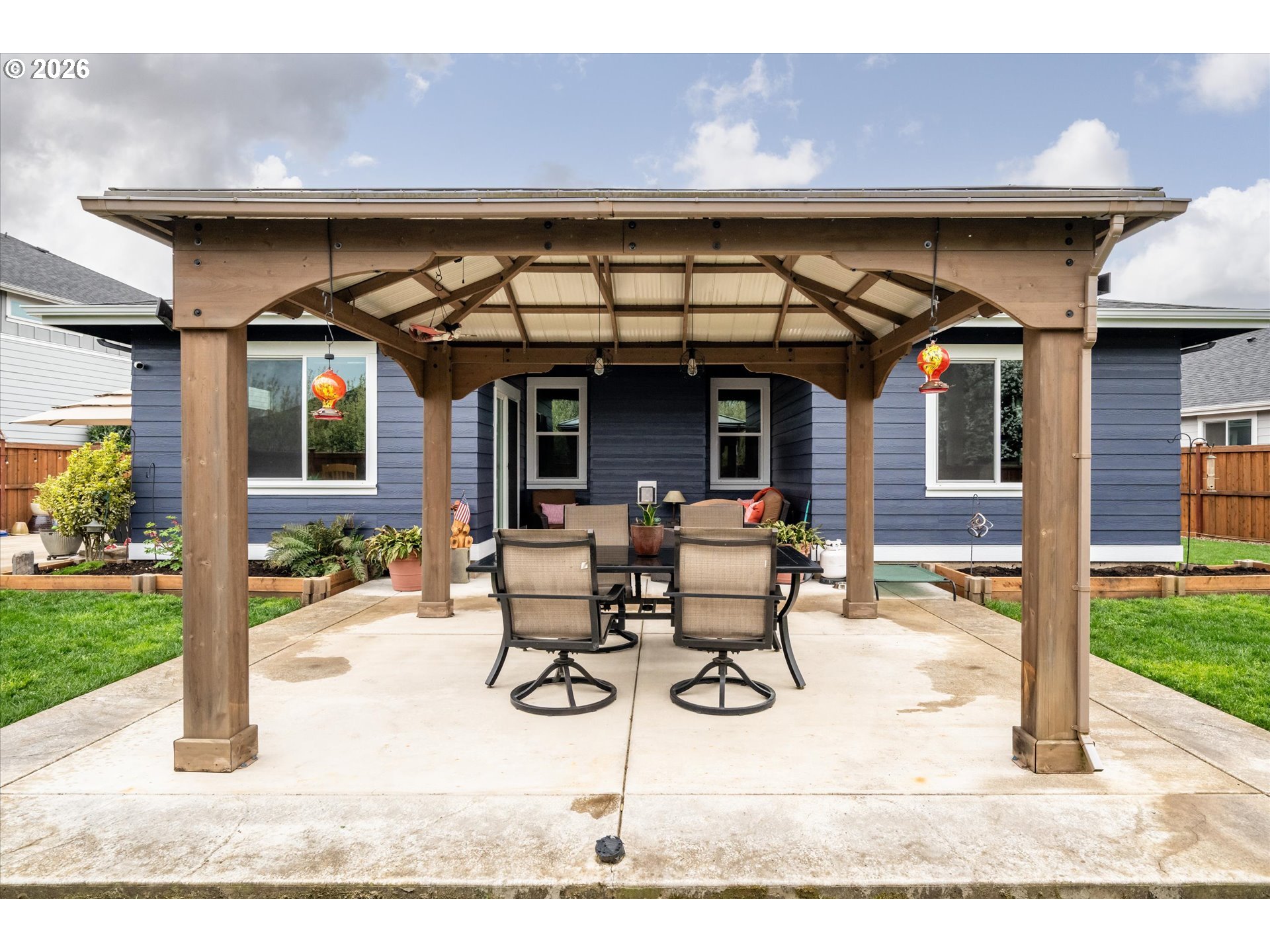 709 Tyson Lane Eugene, OR 97404 - Photo 25 of 31 a view of a patio with table and chairs near a yard