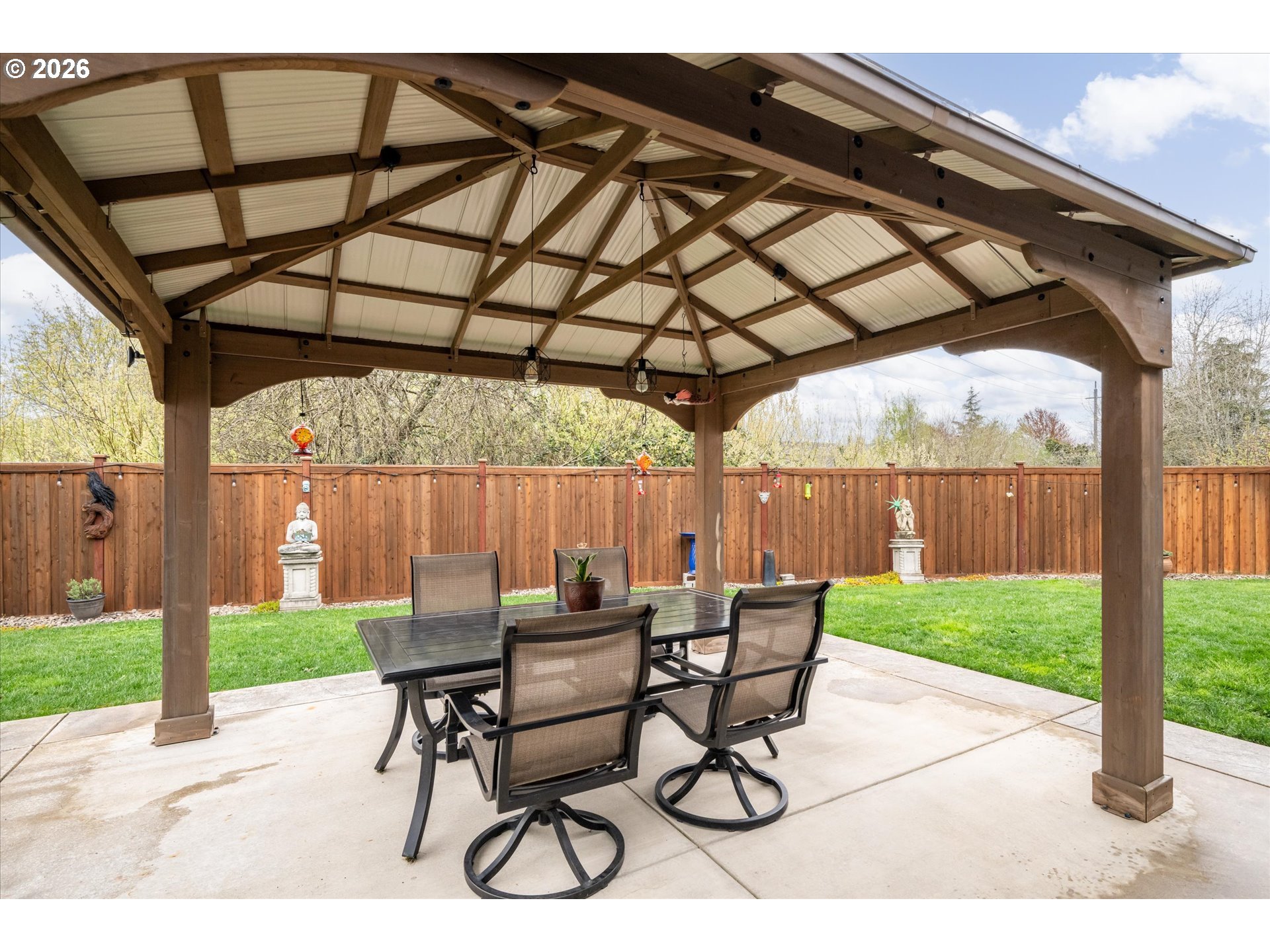 709 Tyson Lane Eugene, OR 97404 - Photo 28 of 31 a patio with a yard table and chairs