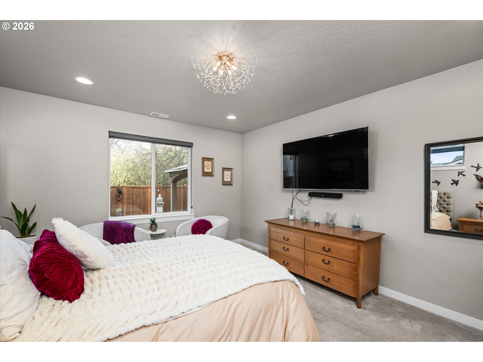709 Tyson Lane Eugene, OR 97404 - Photo 29 of 31 a bedroom with a bed and a flat screen tv