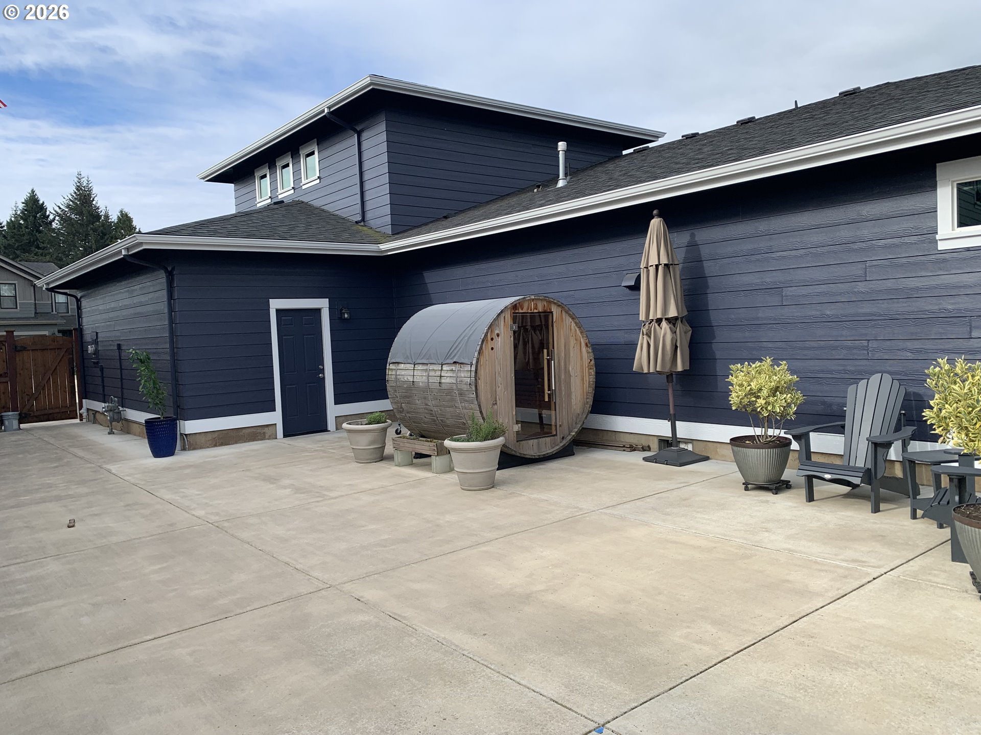 709 Tyson Lane Eugene, OR 97404 - Photo 31 of 31 a view of a house with patio and a yard
