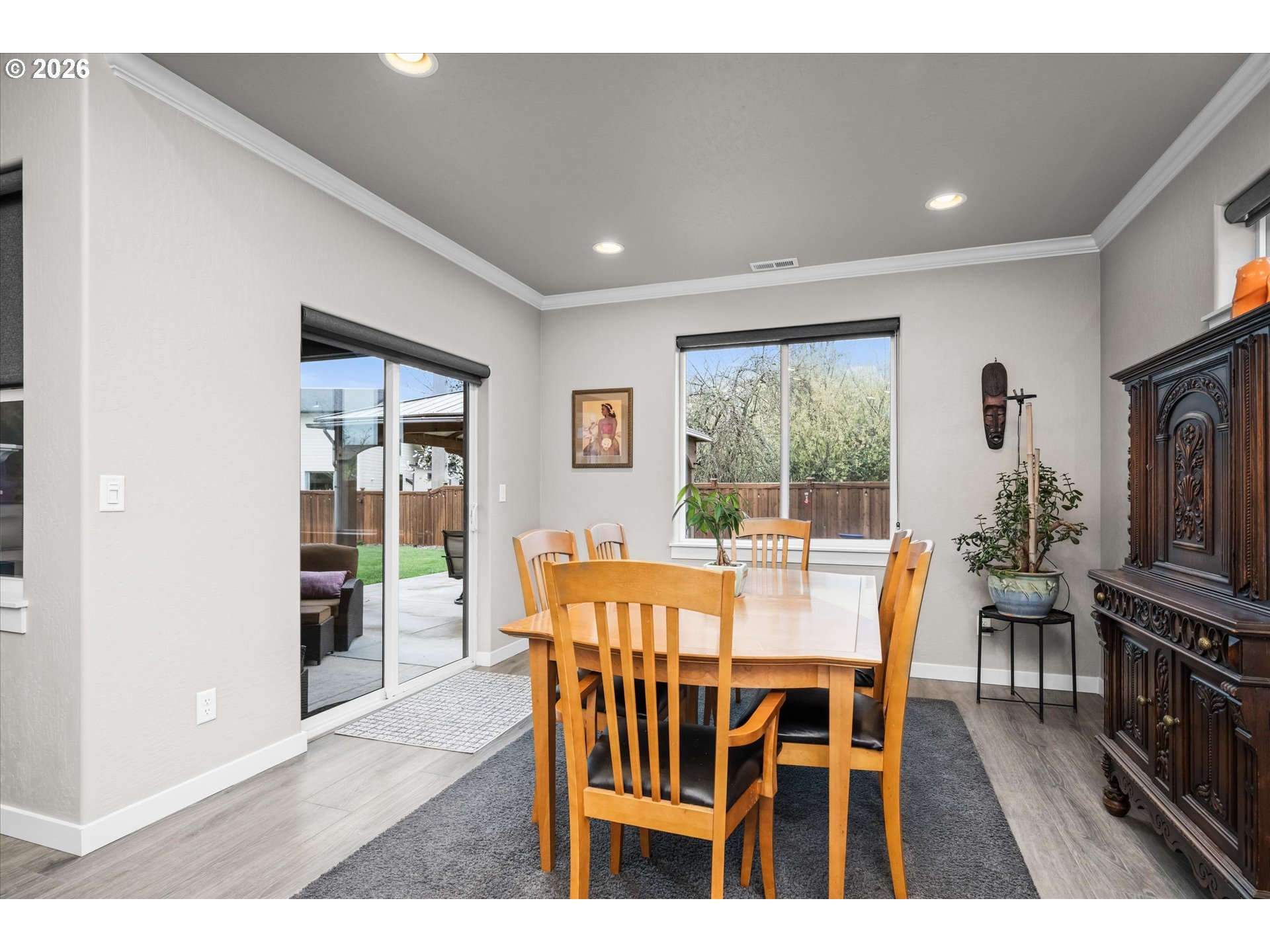 709 Tyson Lane Eugene, OR 97404 - Photo 9 of 31 a view of a dining room with furniture window and wooden floor