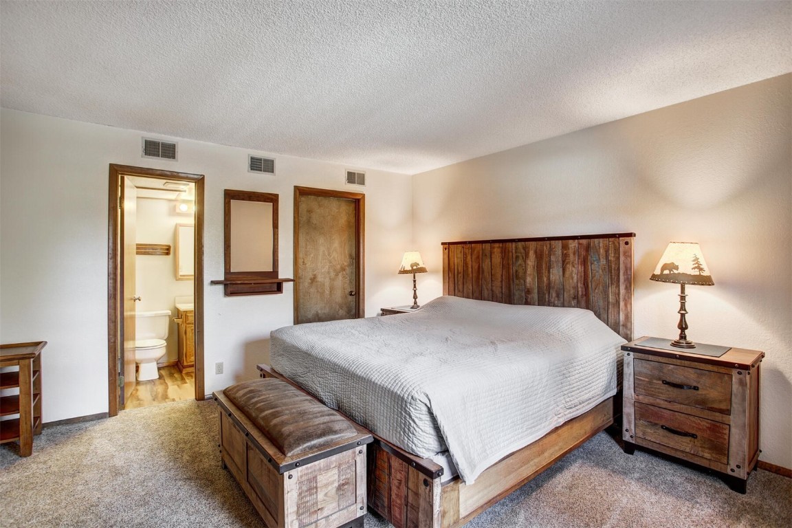 570 Bills Ranch Road, Unit 115 Frisco, CO 80443 - Photo 11 of 31 a bedroom with a bed and a dresser
