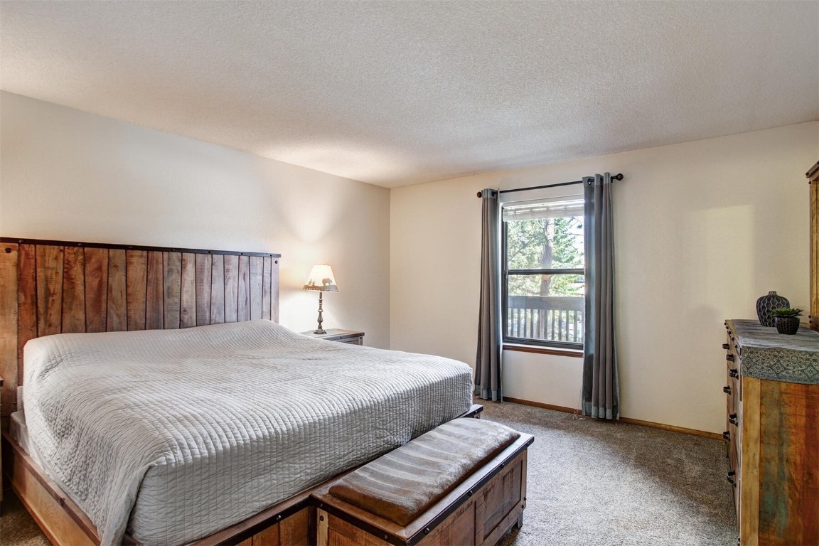 570 Bills Ranch Road, Unit 115 Frisco, CO 80443 - Photo 12 of 31 a bedroom with a bed and a window