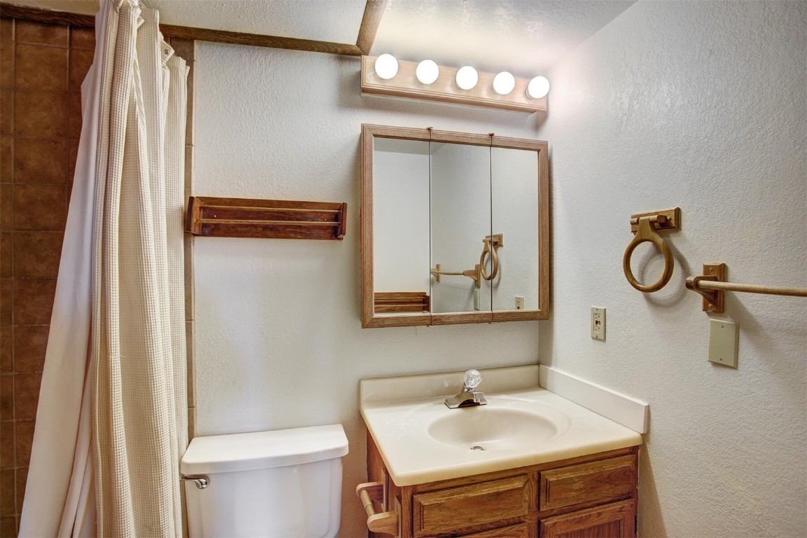 570 Bills Ranch Road, Unit 115 Frisco, CO 80443 - Photo 13 of 31 a bathroom with a sink mirror and toilet