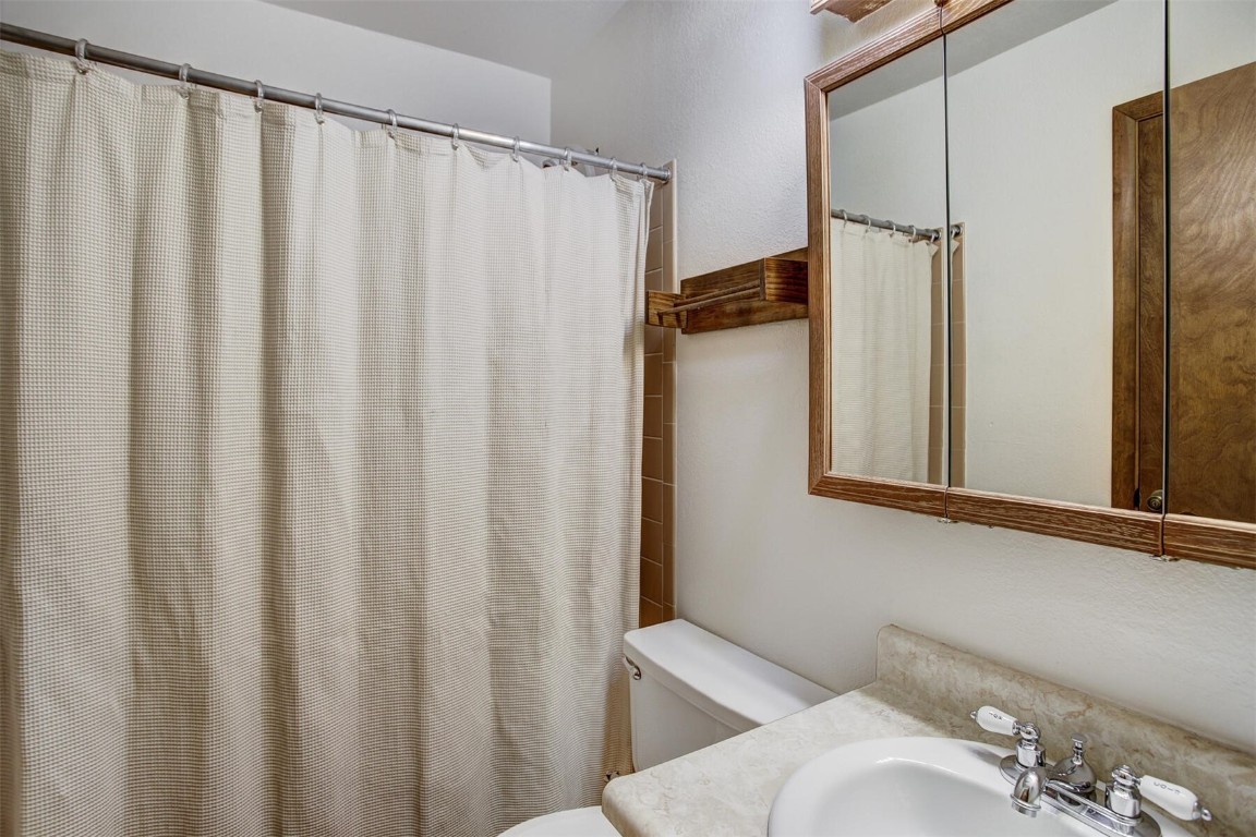570 Bills Ranch Road, Unit 115 Frisco, CO 80443 - Photo 17 of 31 a bathroom with a shower curtain and a sink