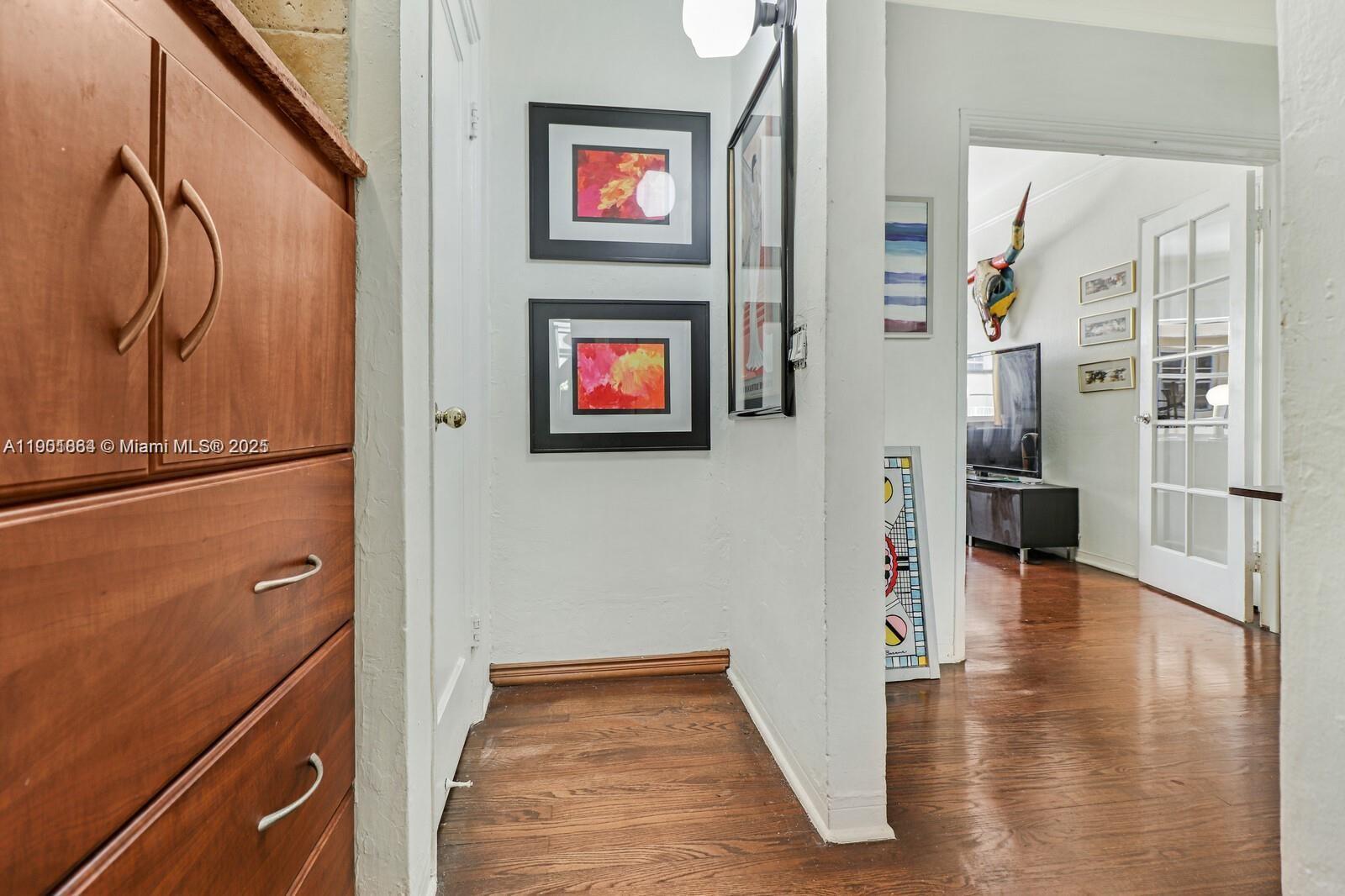 1250 Drexel Avenue, Unit 7 Miami Beach, FL 33139 - Photo 19 of 30 a view of a hallway with wooden floor and staircase