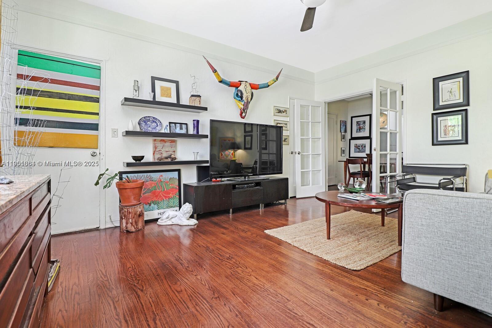 1250 Drexel Avenue, Unit 7 Miami Beach, FL 33139 - Photo 3 of 30 a living room with fireplace furniture and a flat screen tv