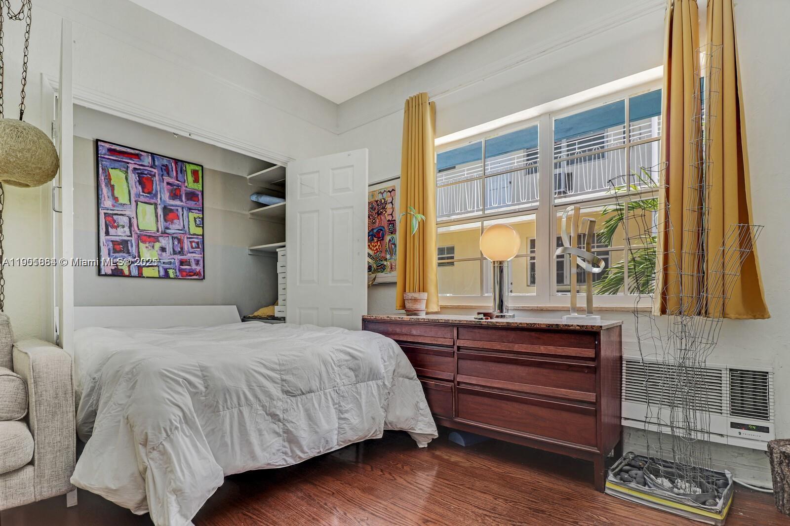 1250 Drexel Avenue, Unit 7 Miami Beach, FL 33139 - Photo 5 of 30 a bedroom with a bed and window