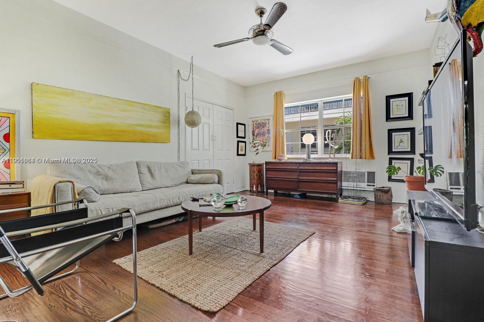 1250 Drexel Avenue, Unit 7 Miami Beach, FL 33139 - Photo 6 of 30 a living room with furniture and wooden floor