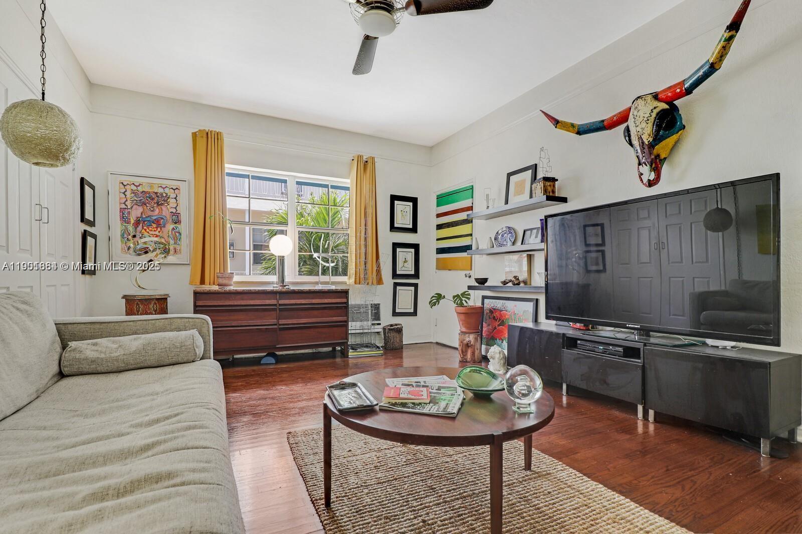1250 Drexel Avenue, Unit 7 Miami Beach, FL 33139 - Photo 8 of 30 a living room with furniture and a flat screen tv