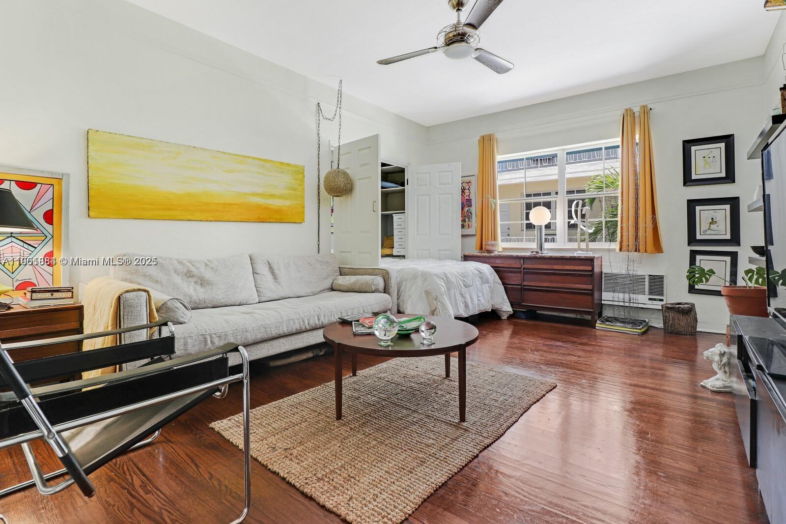 1250 Drexel Avenue, Unit 7 Miami Beach, FL 33139 - Photo 9 of 30 a living room with furniture and a wooden floor