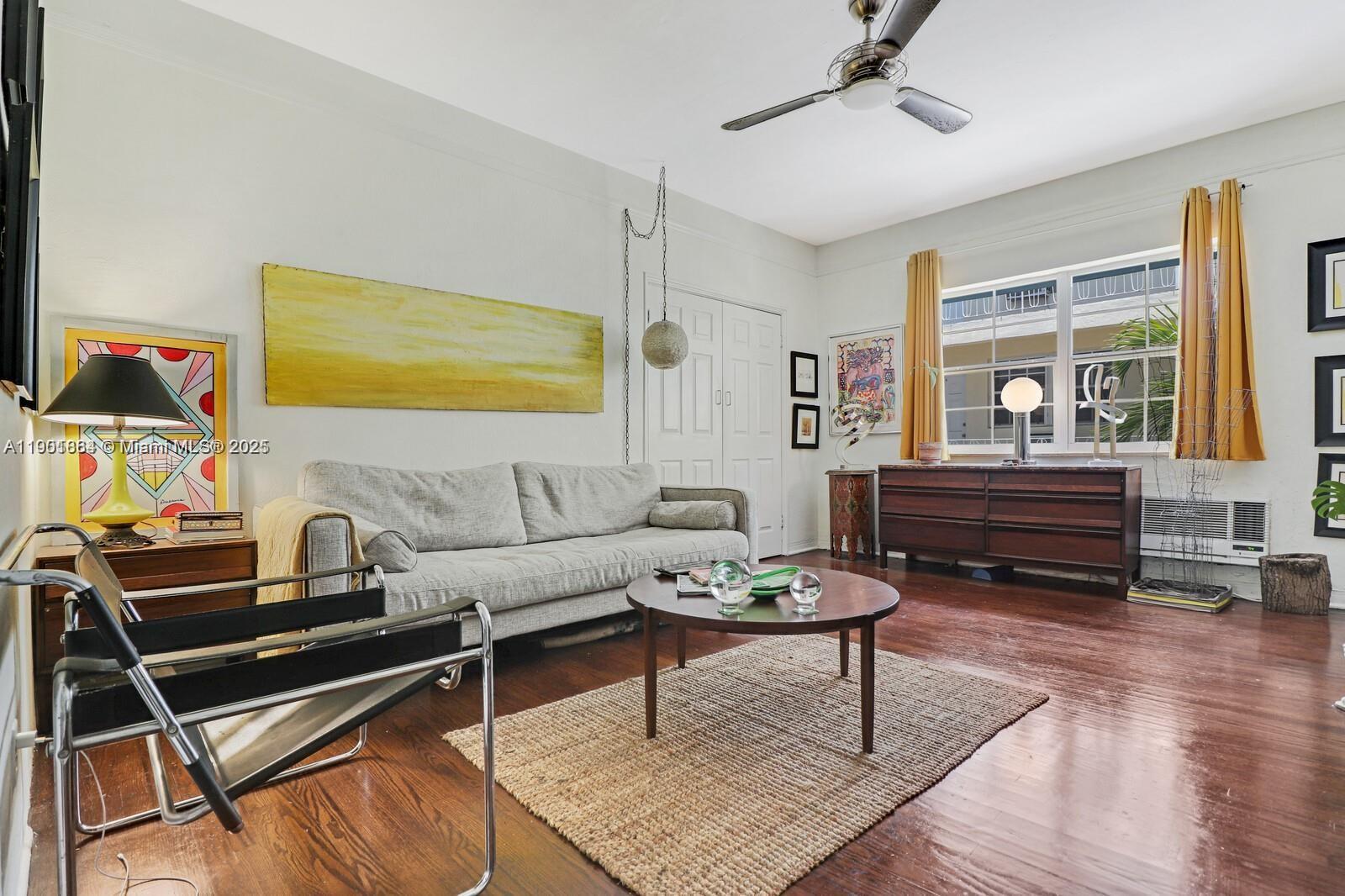 1250 Drexel Avenue, Unit 7 Miami Beach, FL 33139 - Photo 10 of 30 a living room with furniture and a wooden floor