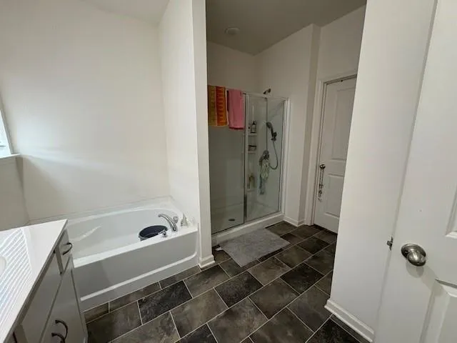 a kitchen with a stove and a refrigerator