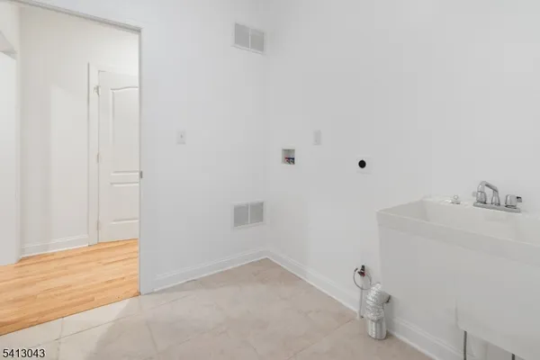 a bathroom with a sink and vanity