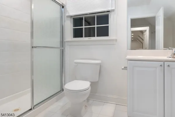 a bathroom with a toilet and a sink