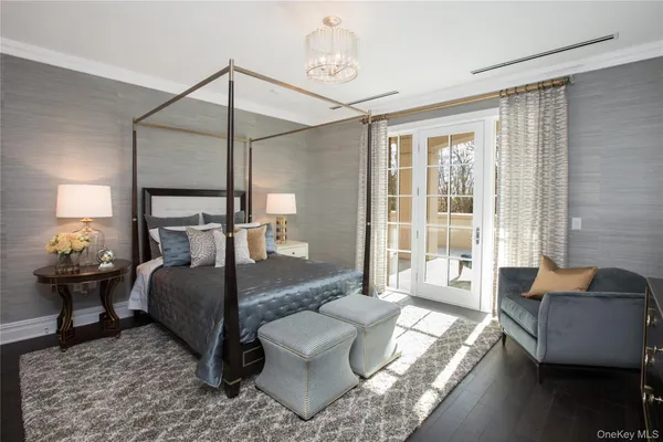 a living room with furniture and a lamp