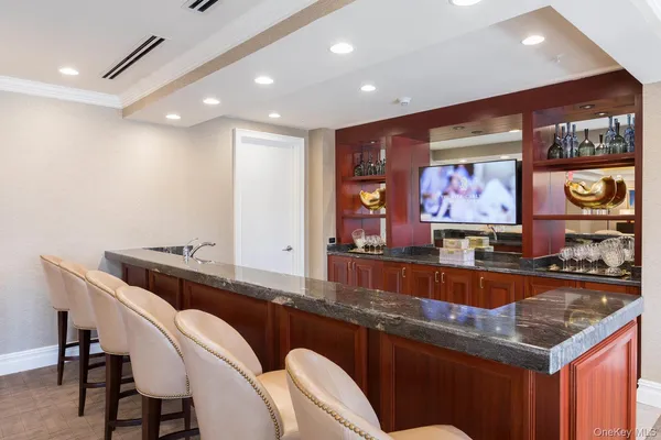 a kitchen with stainless steel appliances granite countertop a sink and cabinets
