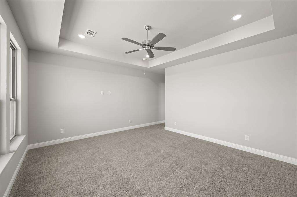 7016 Ranch View Place Springtown, TX 76082 - Photo 14 of 29 an empty room with a window and a ceiling fan