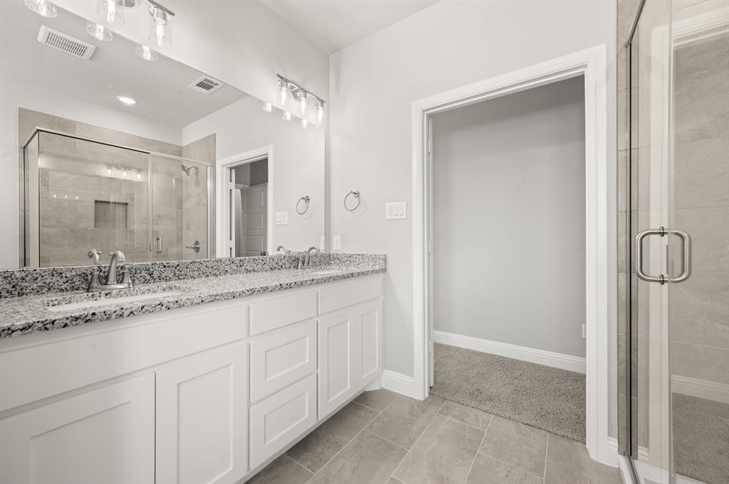 7016 Ranch View Place Springtown, TX 76082 - Photo 16 of 29 a bathroom with a granite countertop sink and a mirror