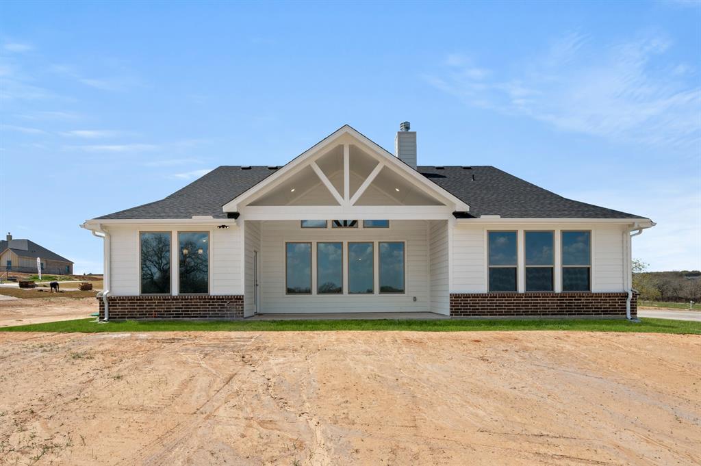 7016 Ranch View Place Springtown, TX 76082 - Photo 28 of 29 a front view of a house with a yard
