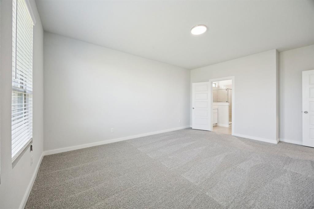 1128 Del Rio Drive Lavon, TX 75166 - Photo 15 of 31 Primary Suite in the Masters home plan by Trophy Signature Homes – REPRESENTATIVE PHOTO