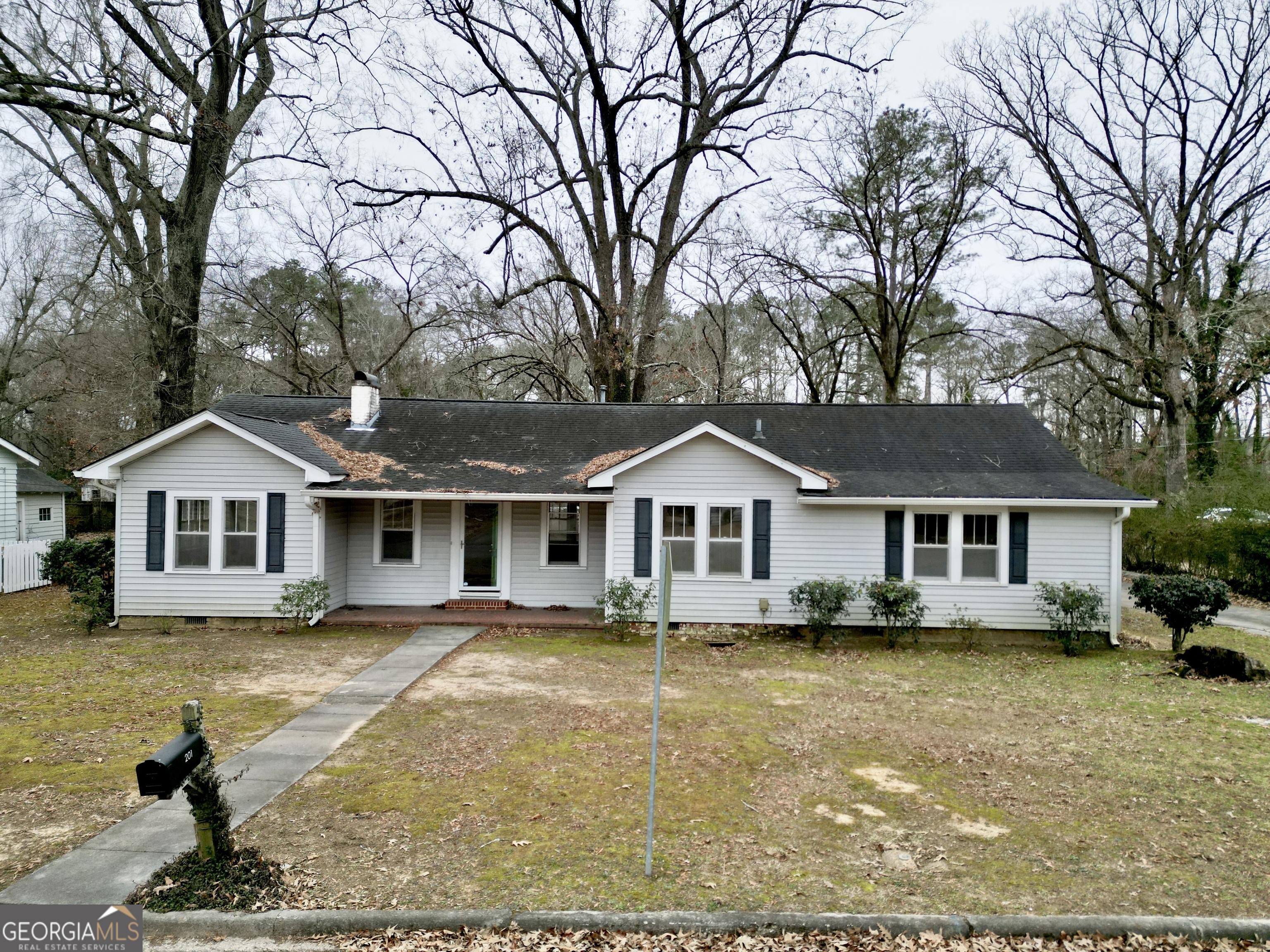 201 Oakwood Street Northwest Rome, GA 30165 - Photo 1 of 1 a front view of a house with a garden and trees