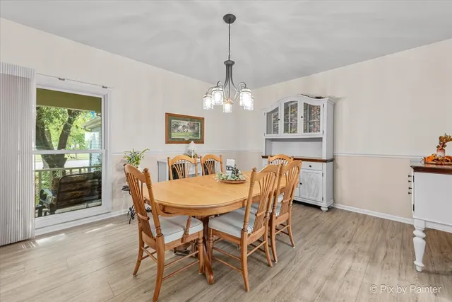 a living room with furniture ceiling fan and a window