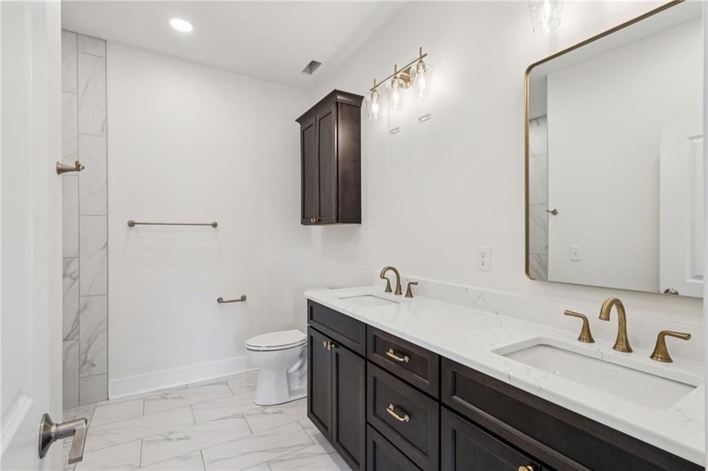 804 2nd Street Beaver, PA 15009 - Photo 15 of 29 a bathroom with a double vanity sink toilet and mirror