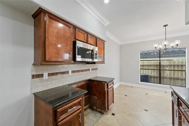 a kitchen that has a sink and a stove in it