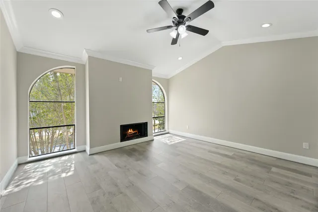 an empty room with fan and a ceiling fan