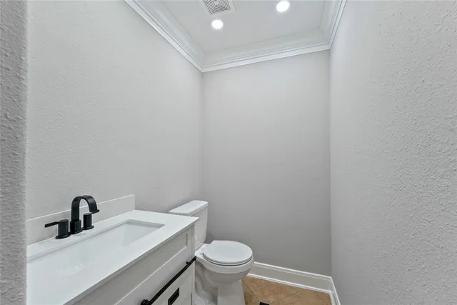 a bathroom with a sink a toilet