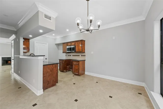 a view of a kitchen with a sink and microwave