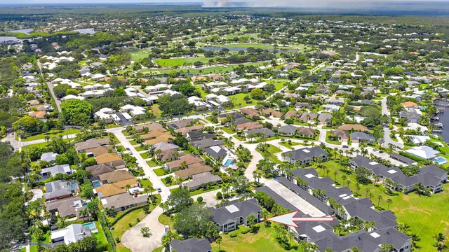 an aerial view of residential houses with outdoor space
