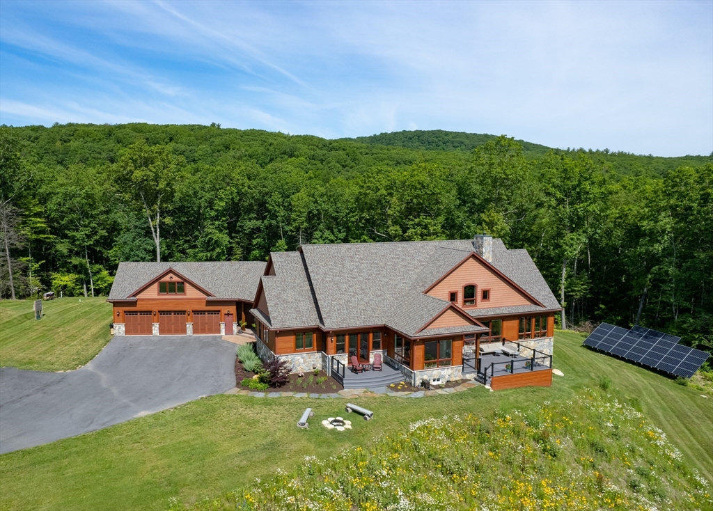 1089 Westhampton Road Northampton, MA 01062 - Photo 1 of 42 an aerial view of a house with swimming pool and garden