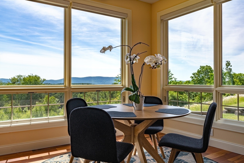 1089 Westhampton Road Northampton, MA 01062 - Photo 21 of 42 a view of a balcony with chairs and a table