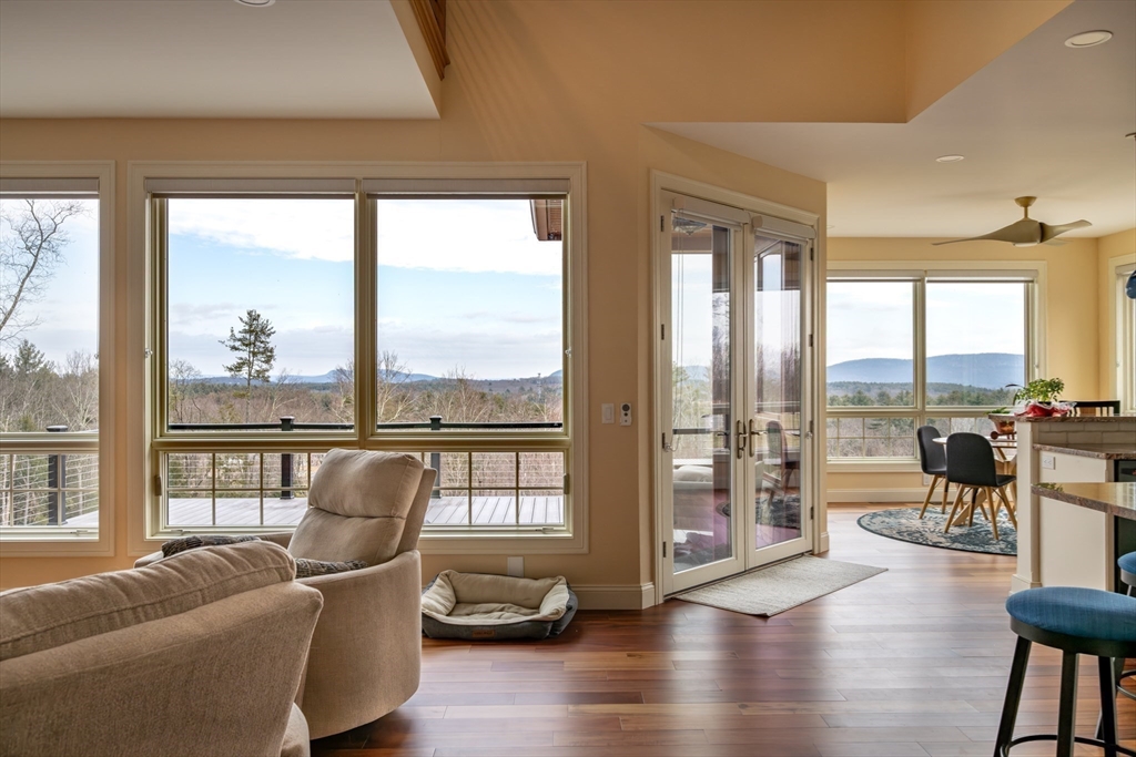 1089 Westhampton Road Northampton, MA 01062 - Photo 22 of 42 a living room with furniture and a large window with garden view