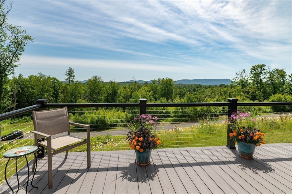 1089 Westhampton Road Northampton, MA 01062 - Photo 24 of 42 a view of a balcony with lake view and wooden floor