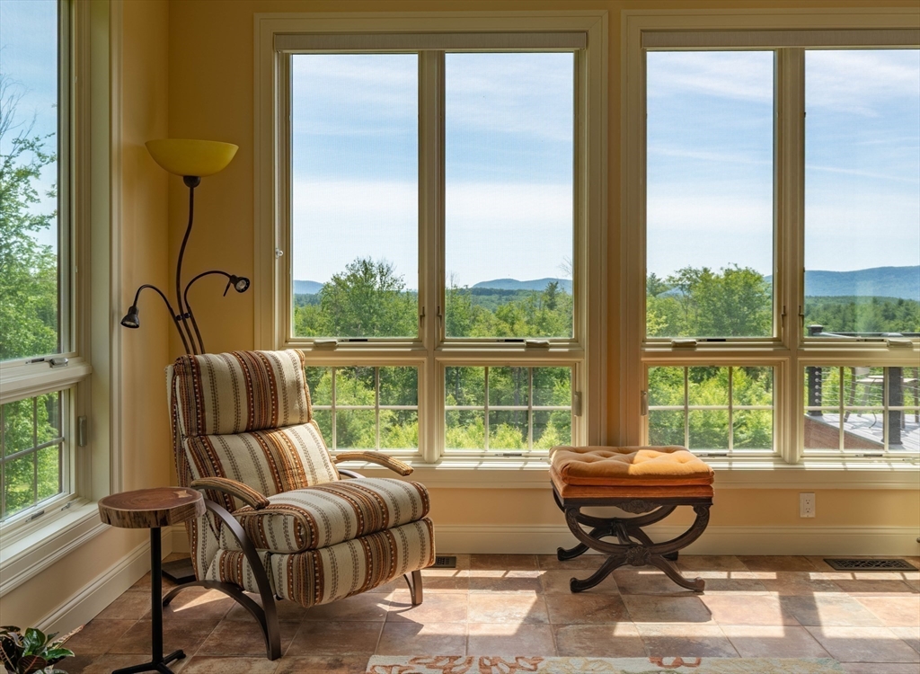 1089 Westhampton Road Northampton, MA 01062 - Photo 26 of 42 a living room with furniture water view and large windows