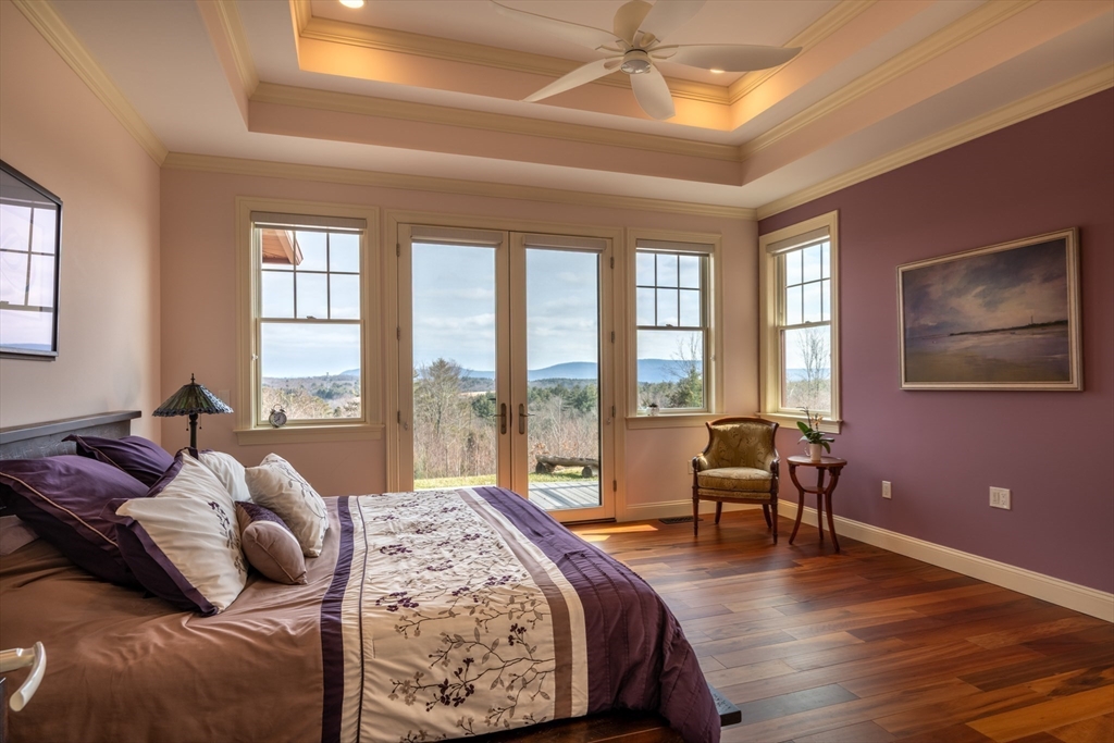 1089 Westhampton Road Northampton, MA 01062 - Photo 31 of 42 a bedroom with a large bed and a large window