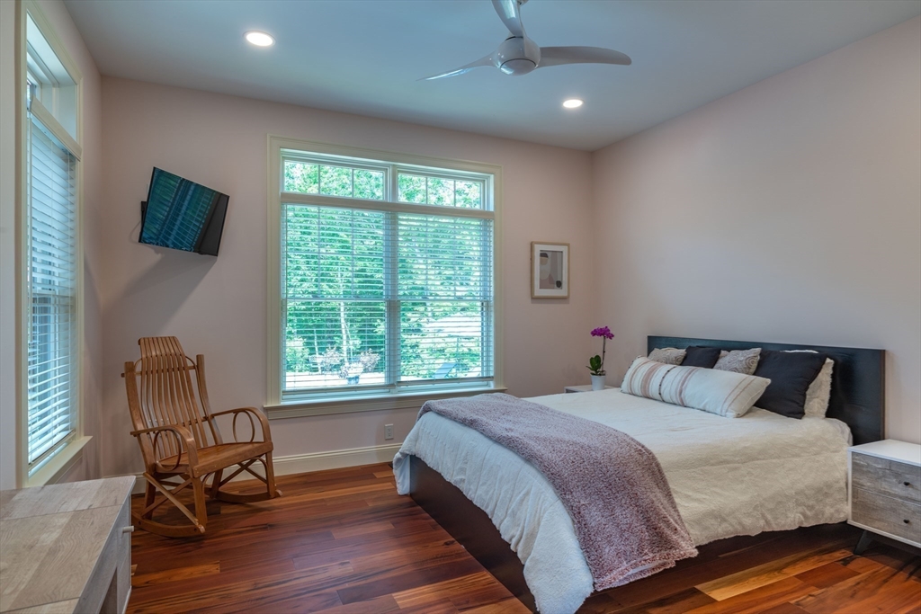 1089 Westhampton Road Northampton, MA 01062 - Photo 34 of 42 a bedroom with a bed a chair and a large window