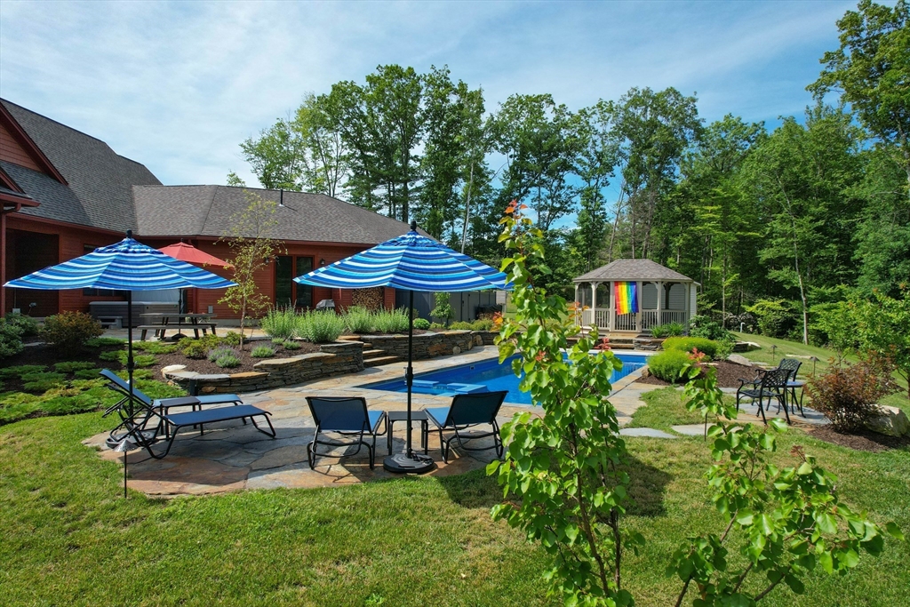 1089 Westhampton Road Northampton, MA 01062 - Photo 6 of 42 a view of pool with table and chairs under an umbrella