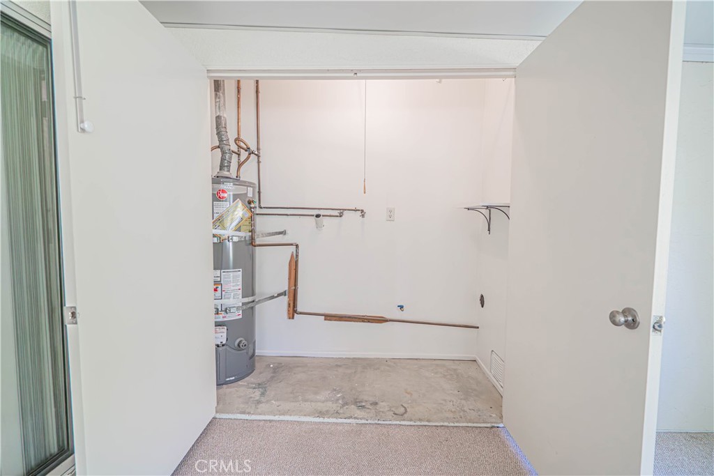 19433 Oak Crossing Road Newhall, CA 91321 - Photo 27 of 53 laundry area in sunroom
