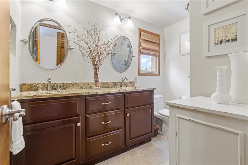115 Windmill Road Butler, PA 16002 - Photo 18 of 36 a bathroom with a granite countertop double vanity sink and a mirror