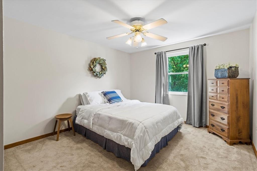 115 Windmill Road Butler, PA 16002 - Photo 23 of 36 a bedroom with a bed and a chandelier
