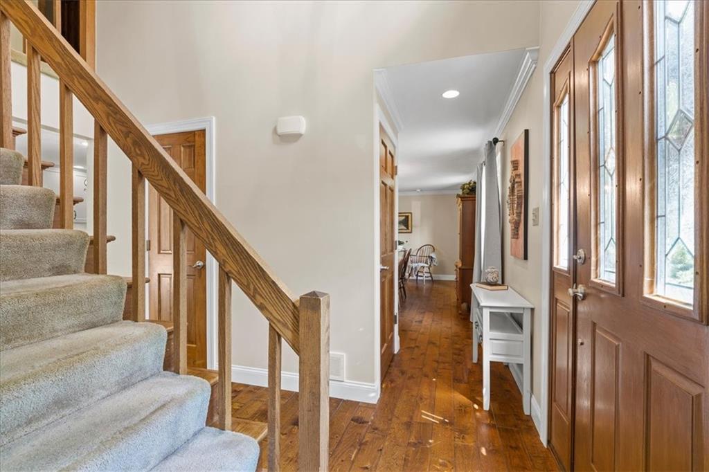 115 Windmill Road Butler, PA 16002 - Photo 3 of 36 a view of staircase with lots of frames and rug