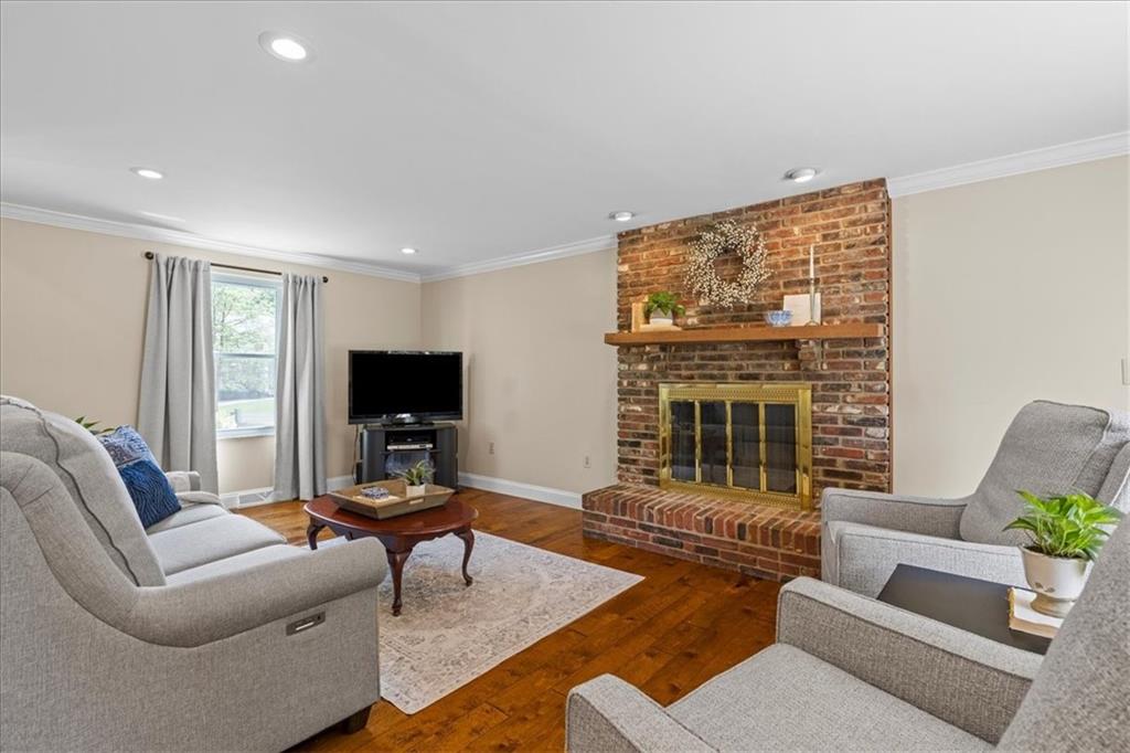 115 Windmill Road Butler, PA 16002 - Photo 6 of 36 a living room with furniture and a flat screen tv