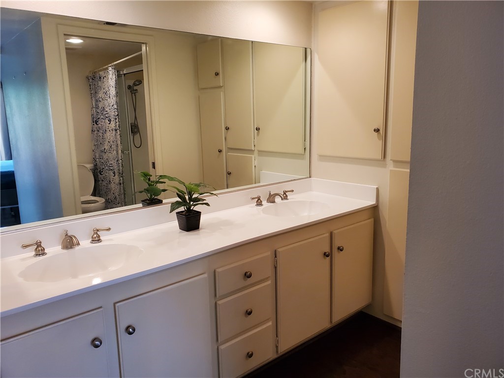 5001 Paseo Dali Irvine, CA 92603 - Photo 15 of 20 a bathroom with a double vanity sink mirror and