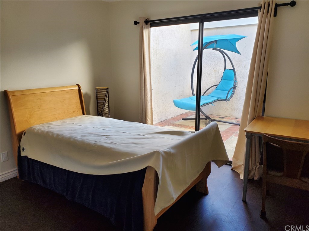 5001 Paseo Dali Irvine, CA 92603 - Photo 17 of 20 a bed sitting in a bedroom next to a window